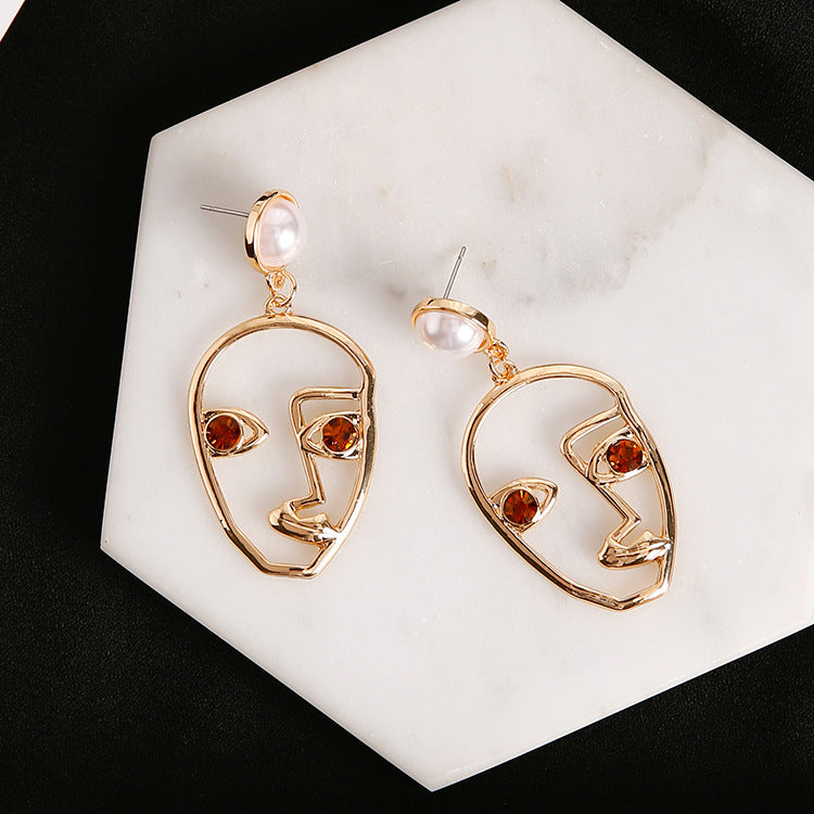 Artistic Hollow Face Pearl Earrings